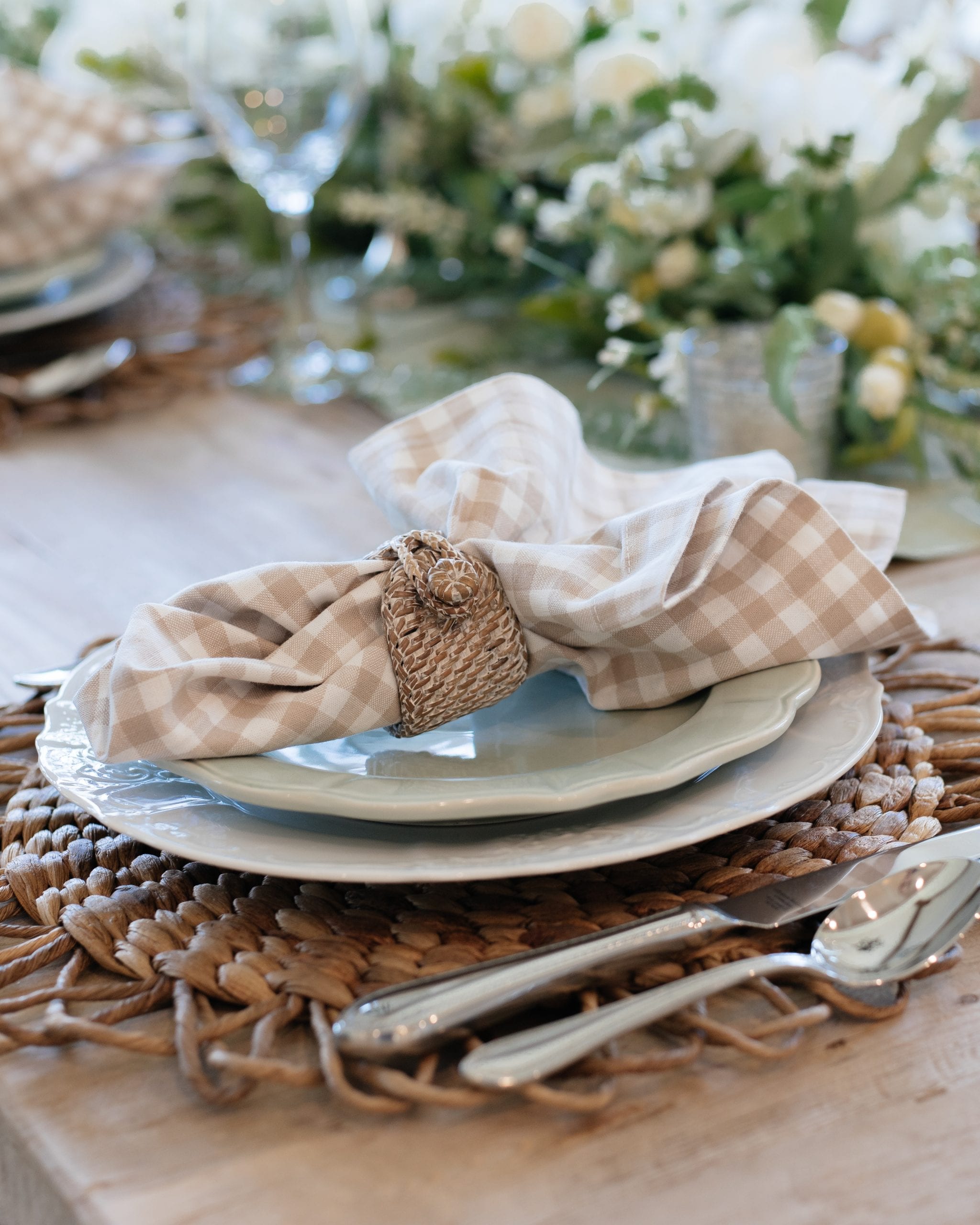 sage green and white indoor place-setting