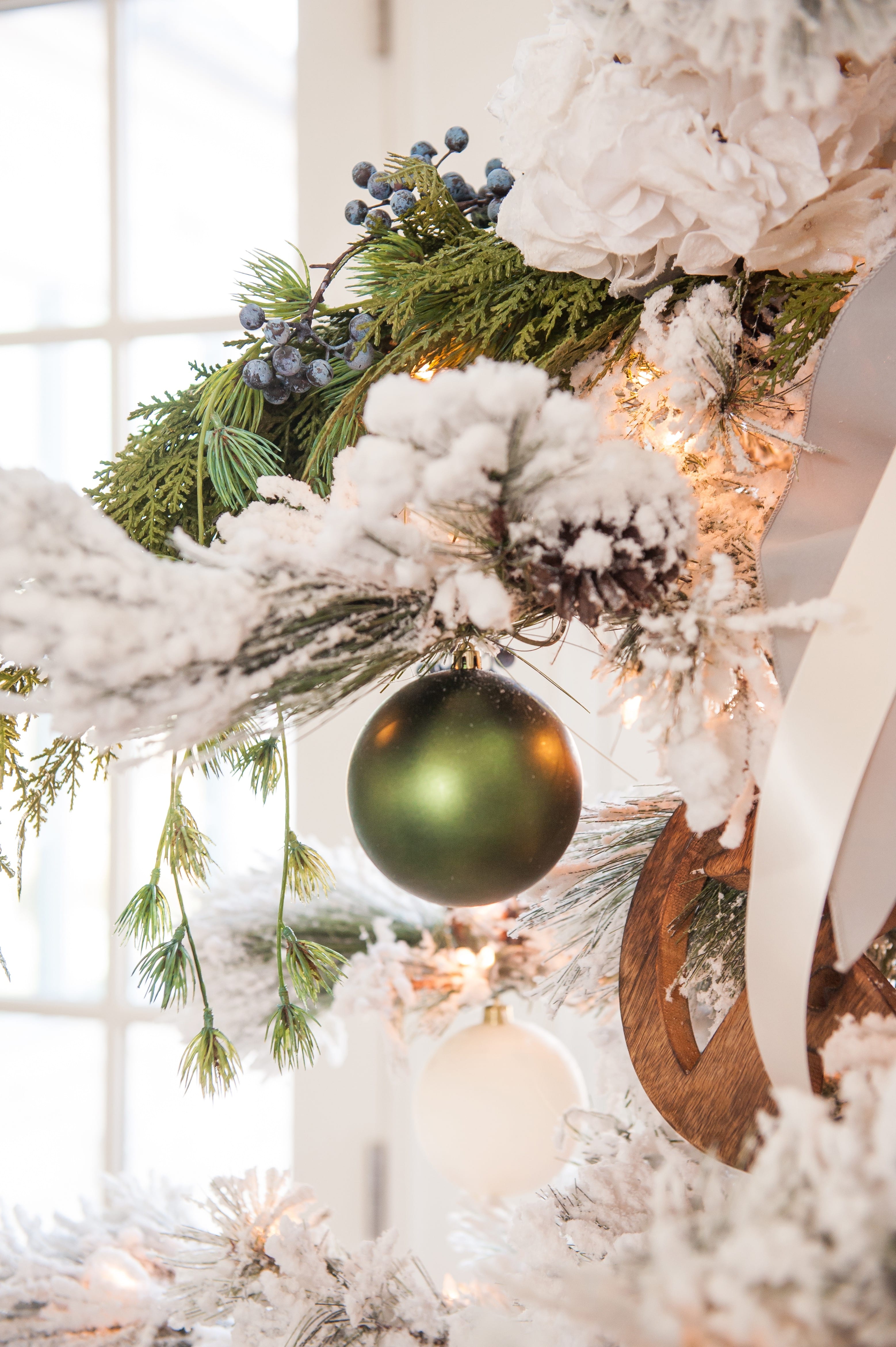 Christmas tree flocked long needle pine christmas tree flocked tree blue decor blue christmas ornaments trimming the tree shades of blue on white blue and cream flocked long needle pine artificial tree blue white ivory cream silver ornaments plaid ribbon