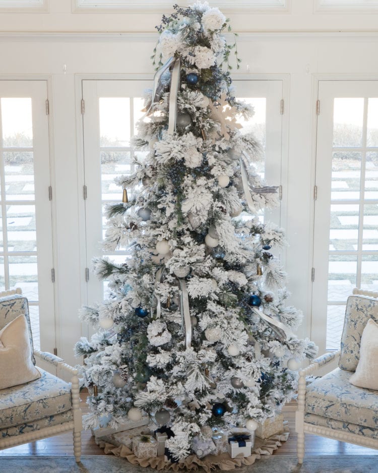 Christmas tree flocked long needle pine christmas tree flocked tree blue decor blue christmas ornaments trimming the tree shades of blue on white blue and cream