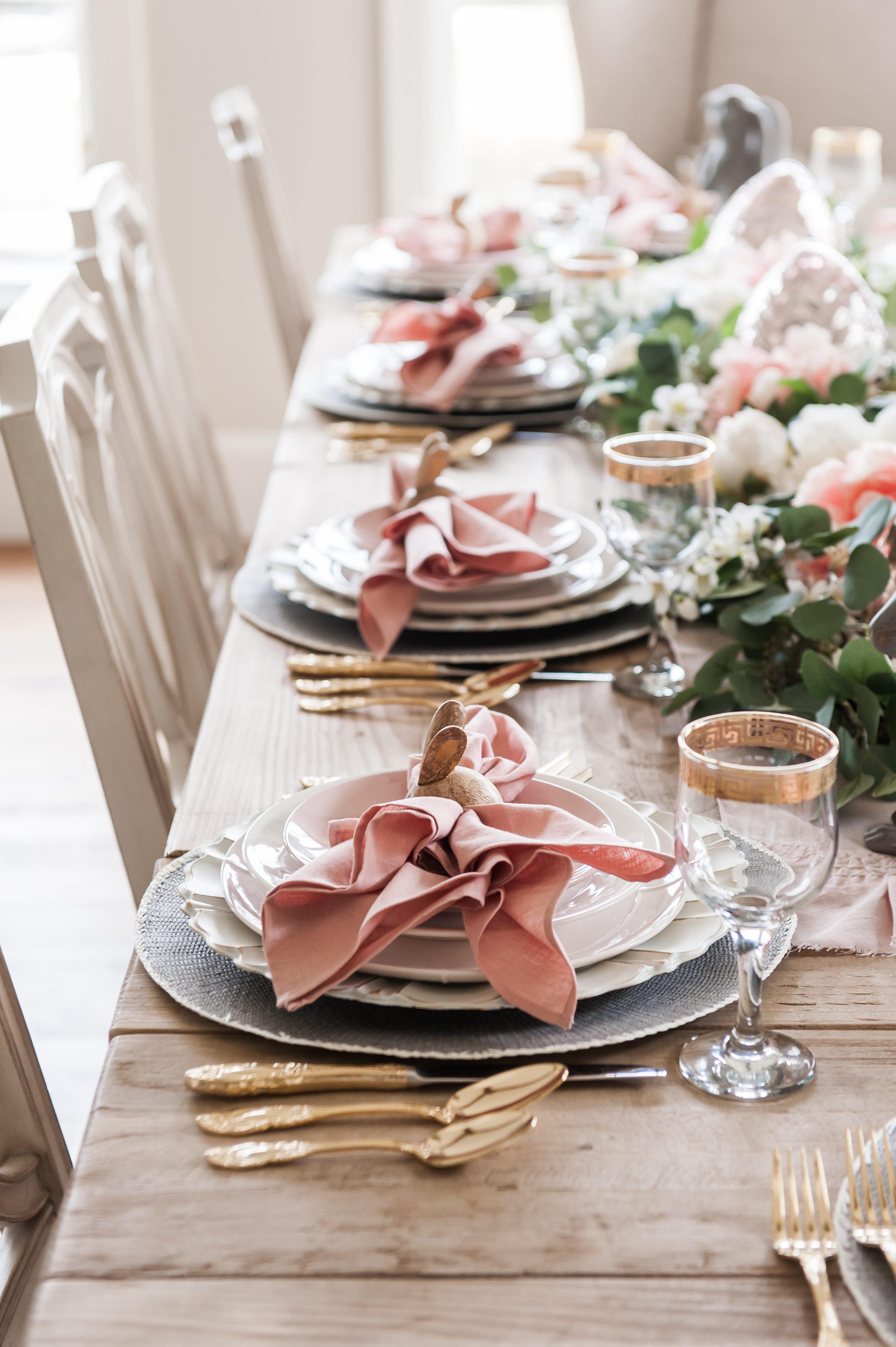 entertaining easter dinner pink easter tablescape table setting place setting bunnies napkin rings pink and gray table decor home decoration dining table dining room table easter table centerpiece garland pink white faux flowers faux greenery