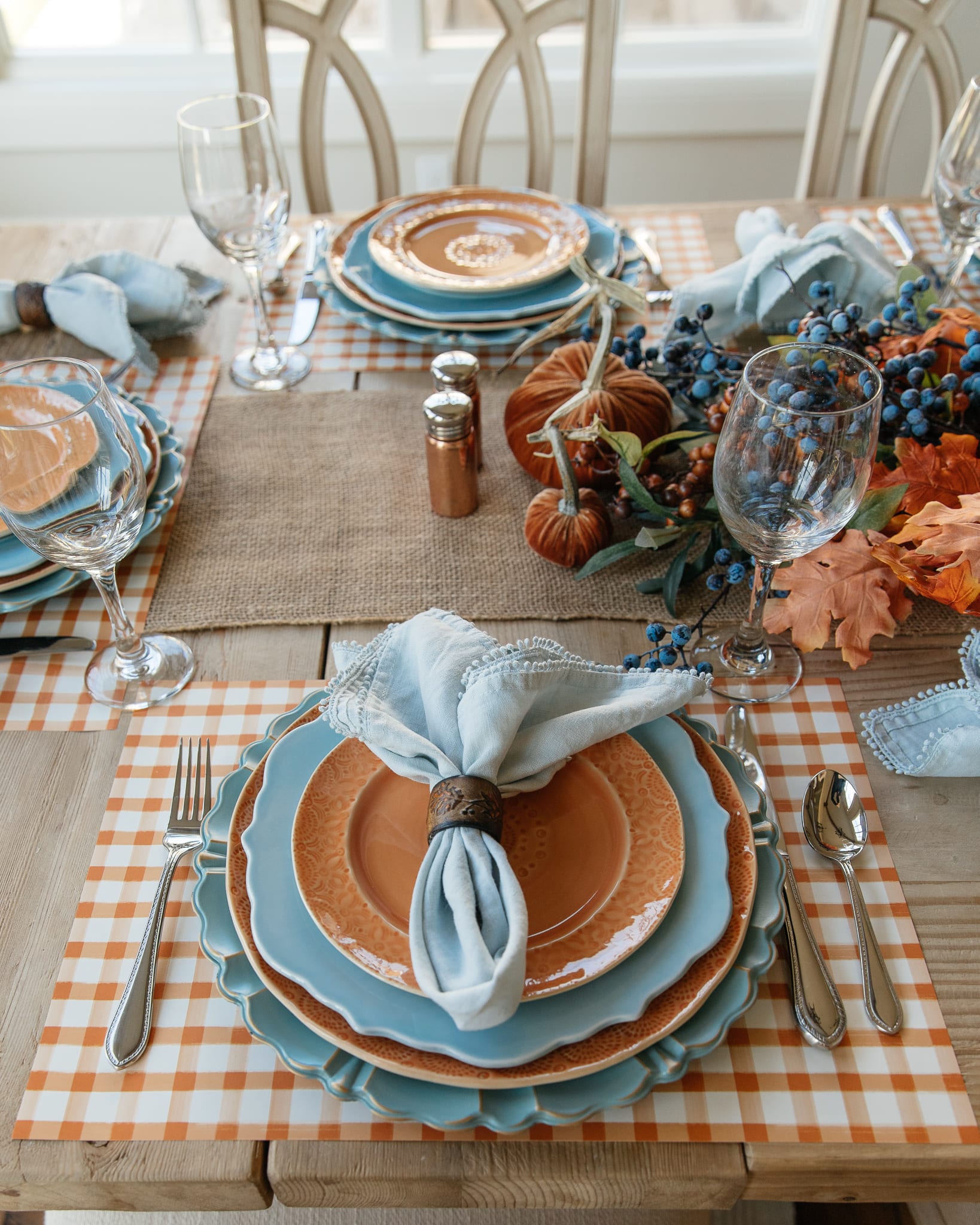 place-setting blue and orange pumpkin tablescape