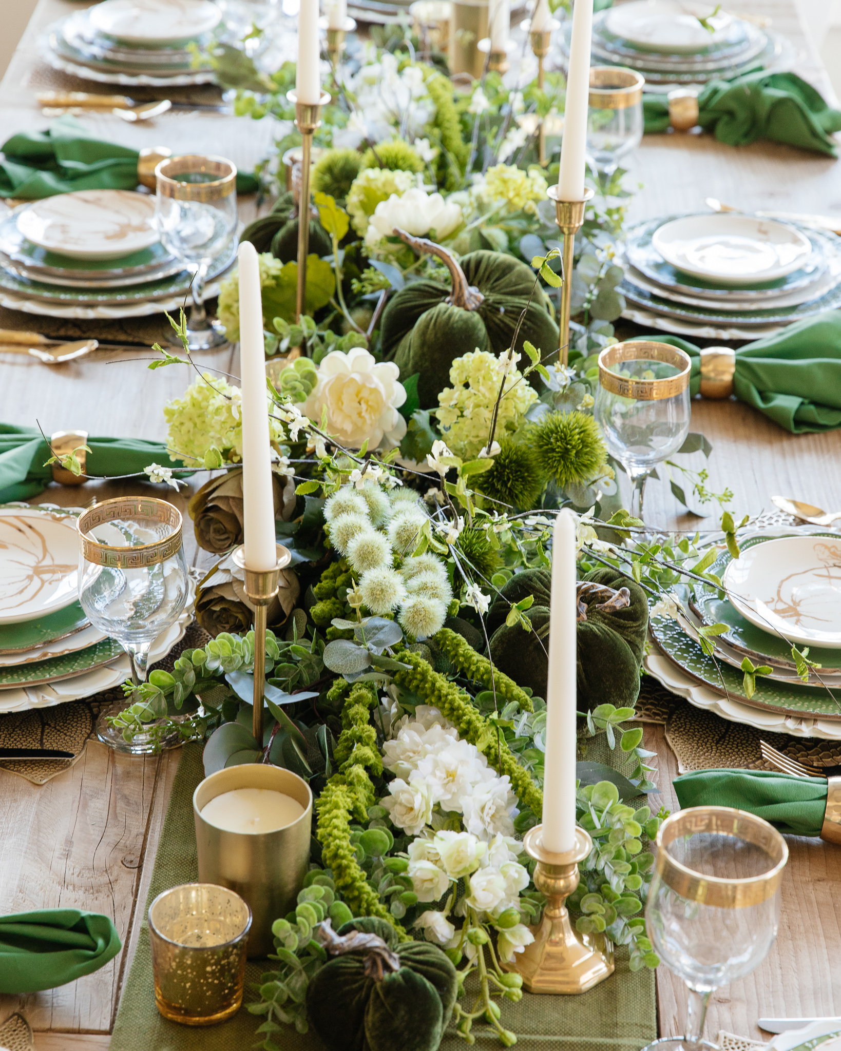 faux flowers layered into garland centerpiece