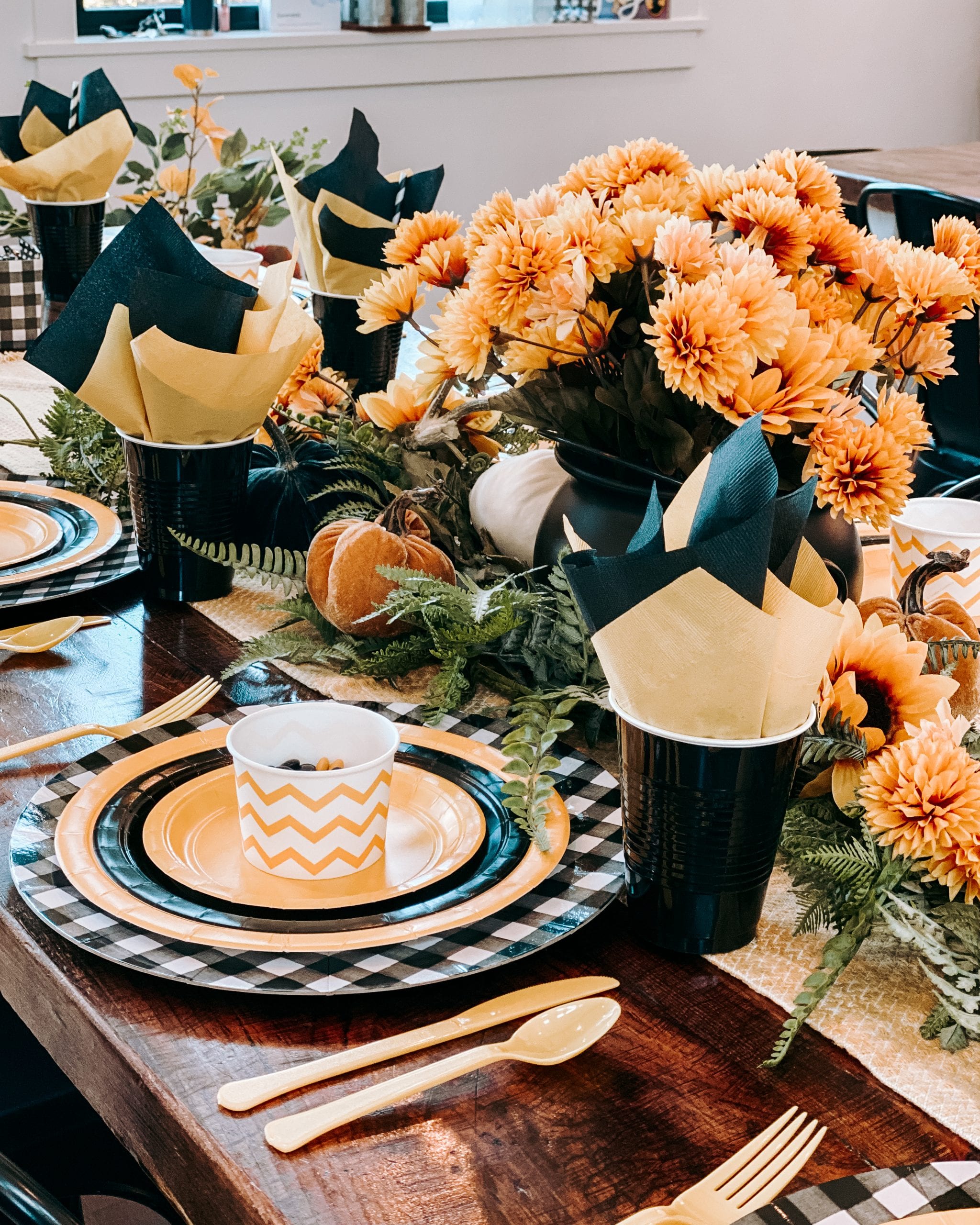 black and yellow paper plate table setting