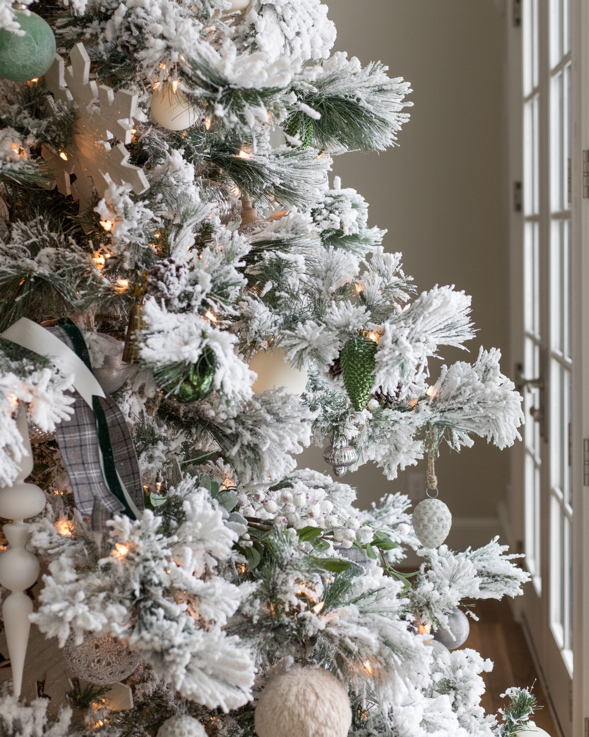 decorated white christmas trees with ribbon