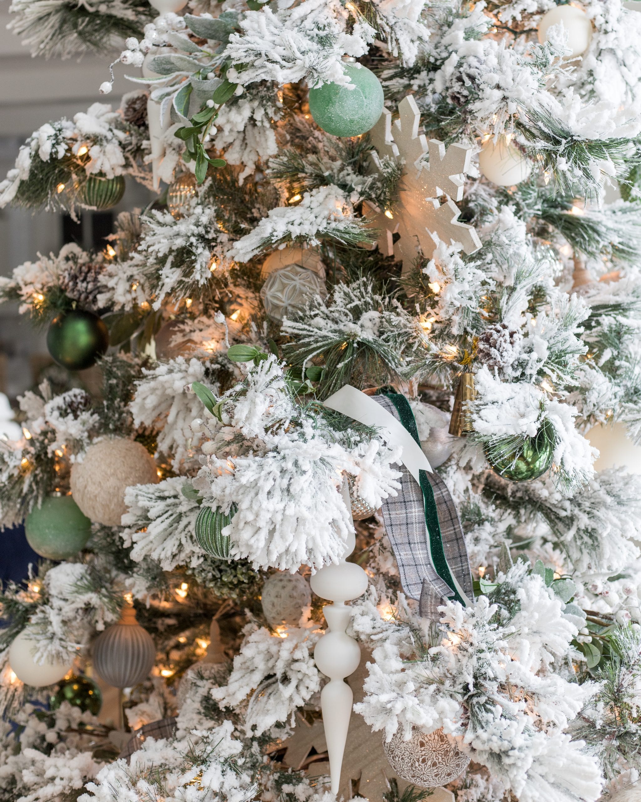 Flocked white Christmas tree with all white and silver decorations