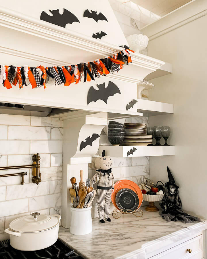 Halloween black and orange decor next to stovetop