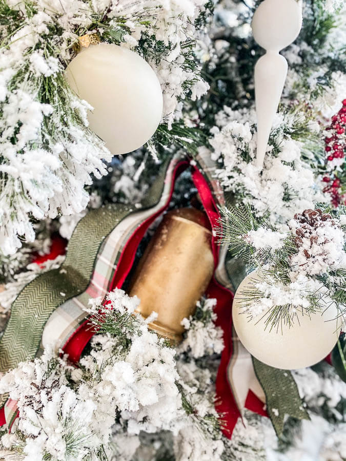 Living Room Christmas Decor Ideas close up of copper bell on tree