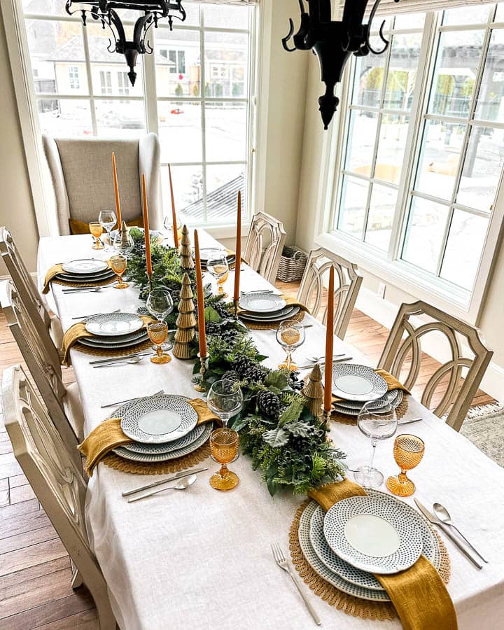 Christmas dinner table decorations in blues and gold following a