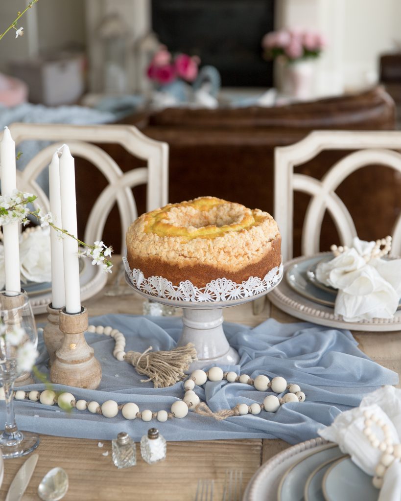 Create a beautiful tablescape for Easter with dusty blue and mango wood accents. Learn how to create this look right now!