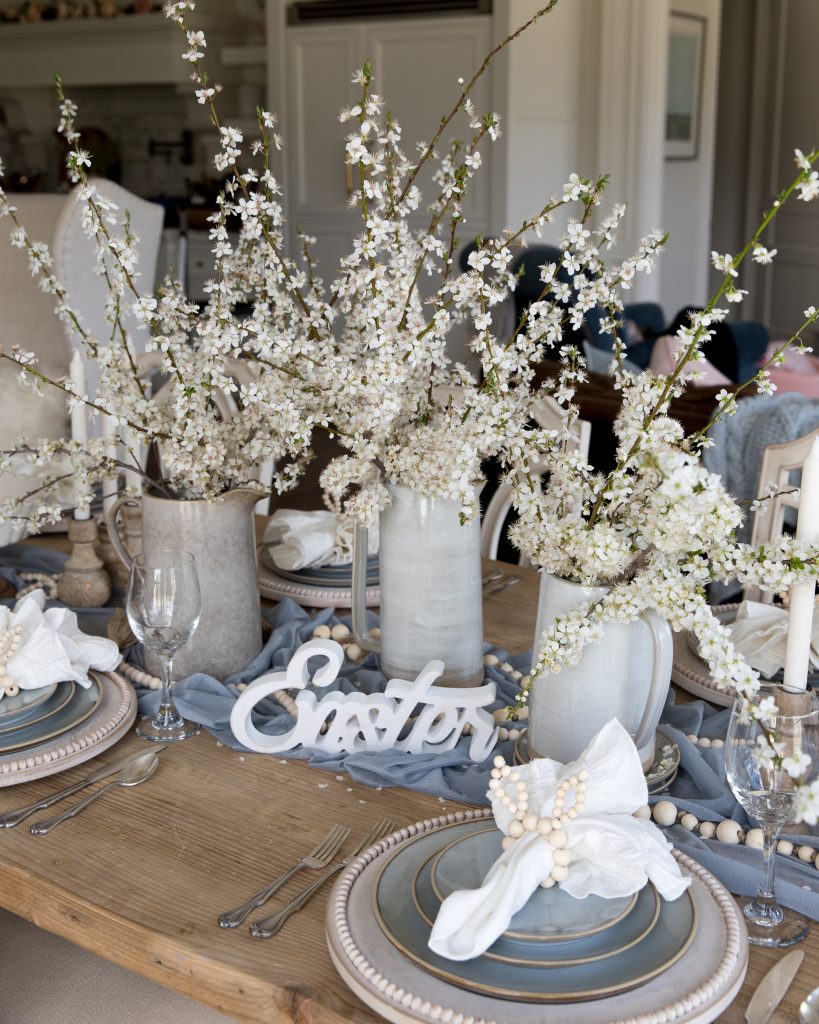 Create a beautiful tablescape for Easter with dusty blue and mango wood accents. Learn how to create this look right now!