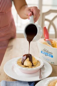 pouring hot chocolate on homemade chocolate chip cazookie recipe