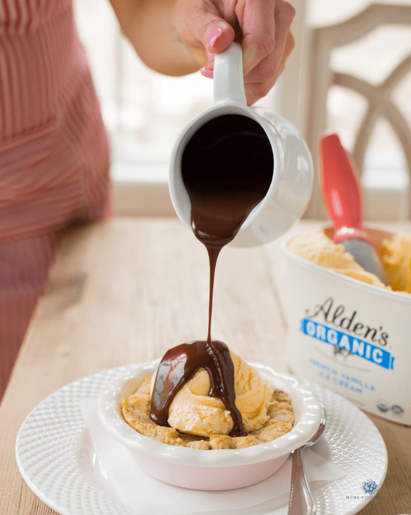 pouring hot chocolate on homemade chocolate chip cazookie recipe