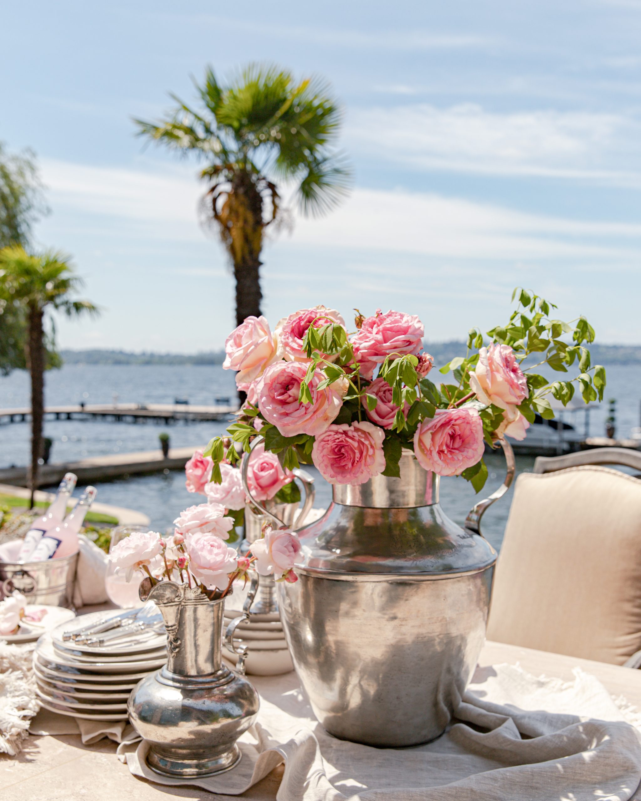 roses and peonies in a silver vase