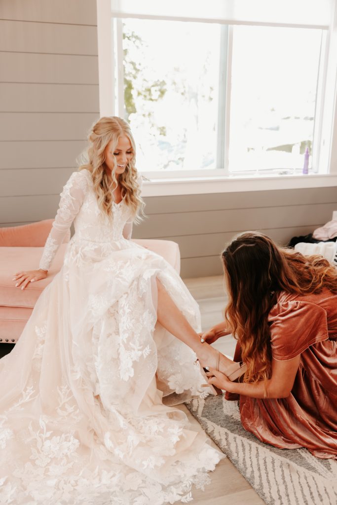 Planning a fall wedding - bride getting her shoes on