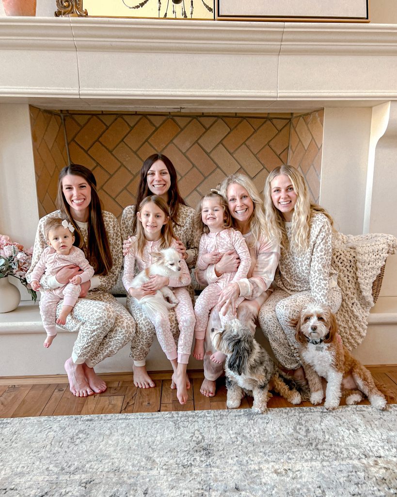 girls sitting on fireplace - Make lasting memories with your family with a Galentine's Day breakfast gathering. Celebrate multiple generations with love, crafts, and treats.