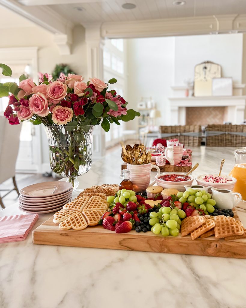 Make lasting memories with your family with a Galentine's Day breakfast gathering with flowers, heart waffles, fruit, and tray